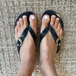 Never worn Tory Burch flip flops black leather Sz 7